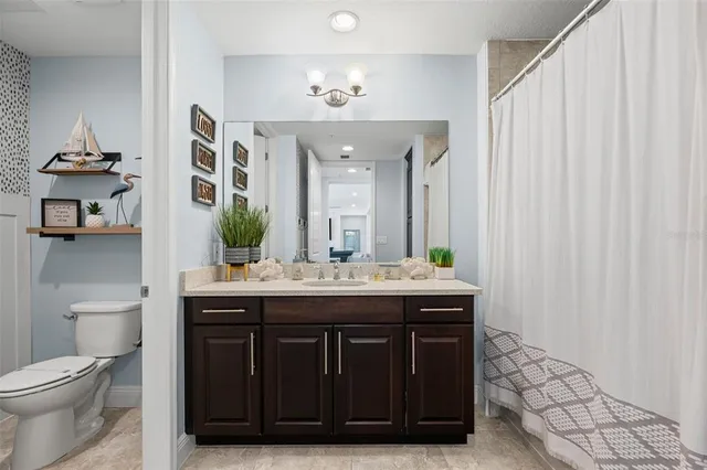 a view of a room with furniture and wooden floor