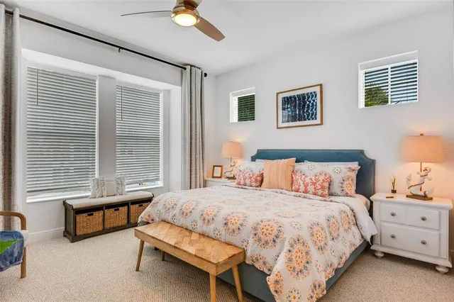 a roof deck with table and chairs potted plants with palm trees