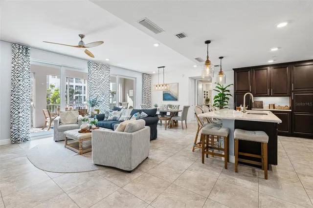 a view of a livingroom with furniture and a flat screen tv