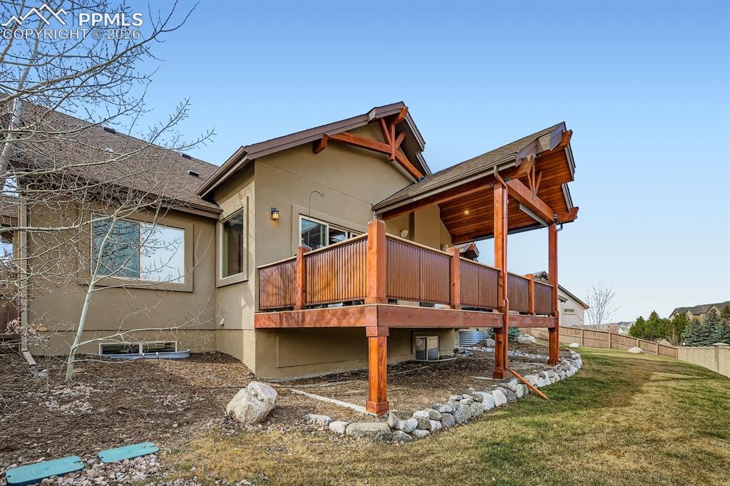 10625 Slumber Ridge Way Colorado Springs, CO 80908 - Photo 32 of 36 rear view of deck