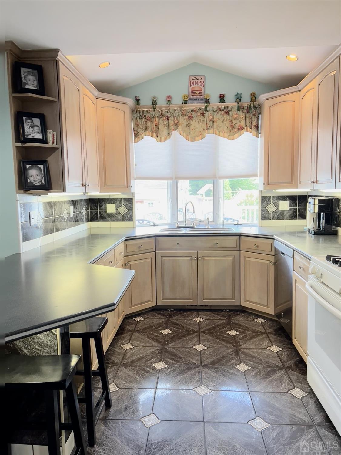 3 Barton Road Old Bridge, NJ 08857 - Photo 13 of 38 a kitchen with a sink window and cabinets