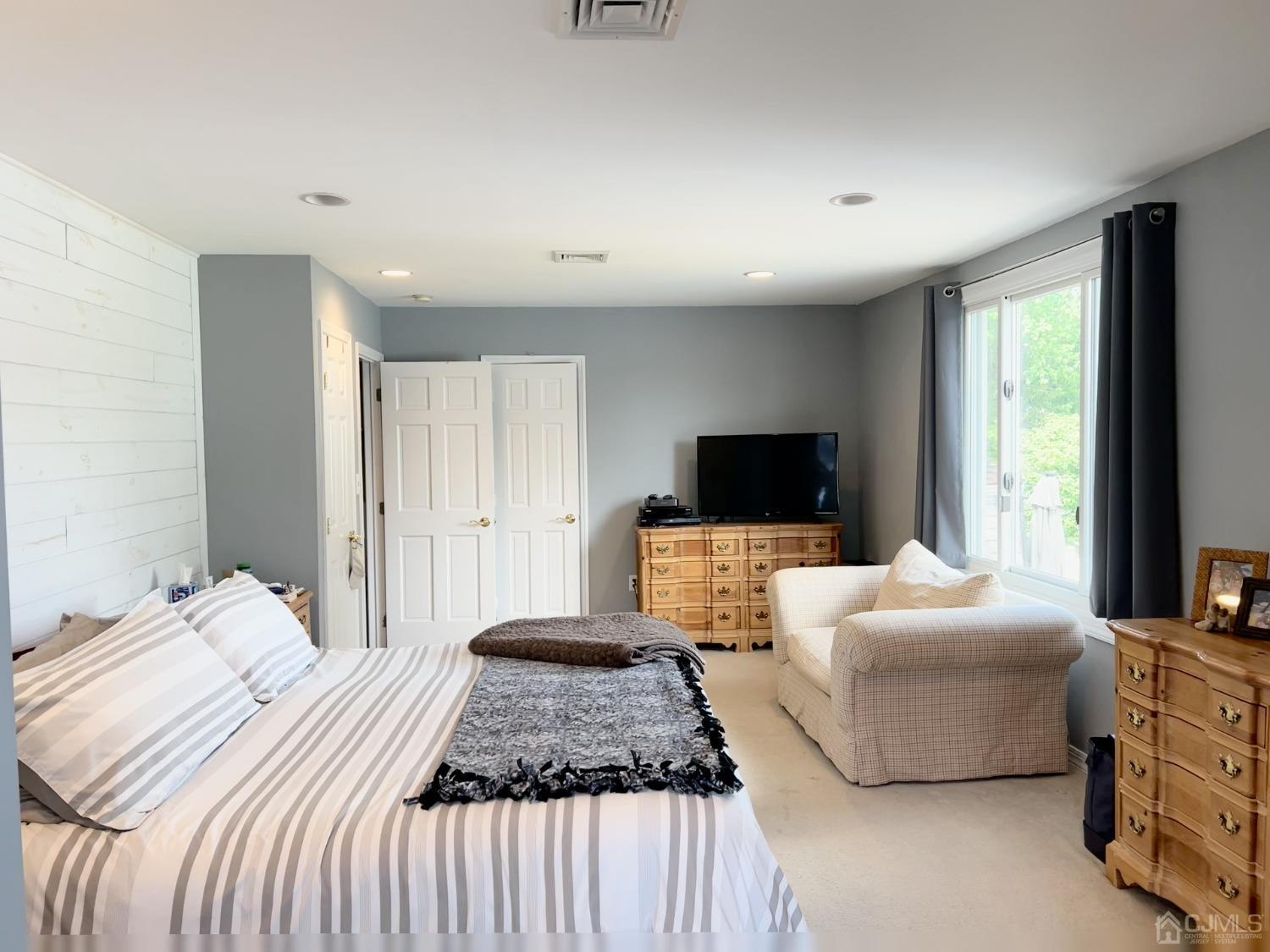 3 Barton Road Old Bridge, NJ 08857 - Photo 23 of 38 a bedroom with a bed and a flat screen tv