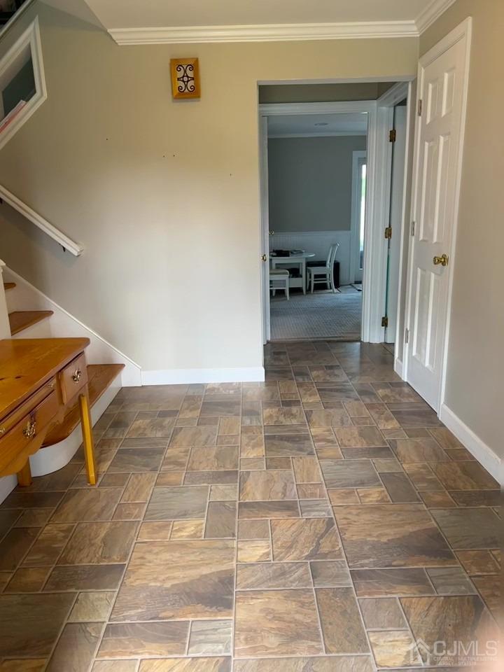 3 Barton Road Old Bridge, NJ 08857 - Photo 33 of 38 a view of a hallway to a livingroom with furniture and an entryway