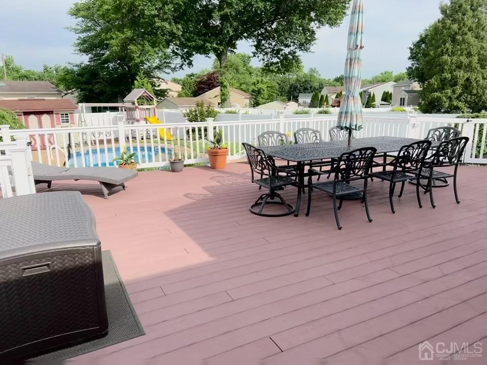 3 Barton Road Old Bridge, NJ 08857 - Photo 5 of 38 a view of a patio with dining table and chairs