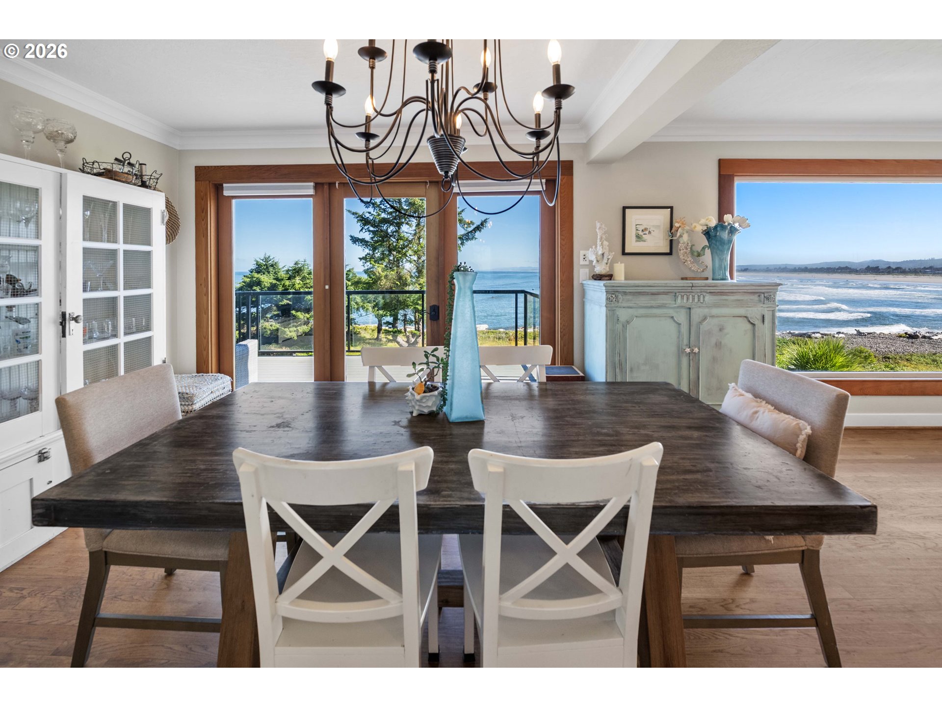 3232 Sunset Boulevard Seaside, OR 97138 - Photo 7 of 48 a view of a dining room with furniture large windows and wooden floor
