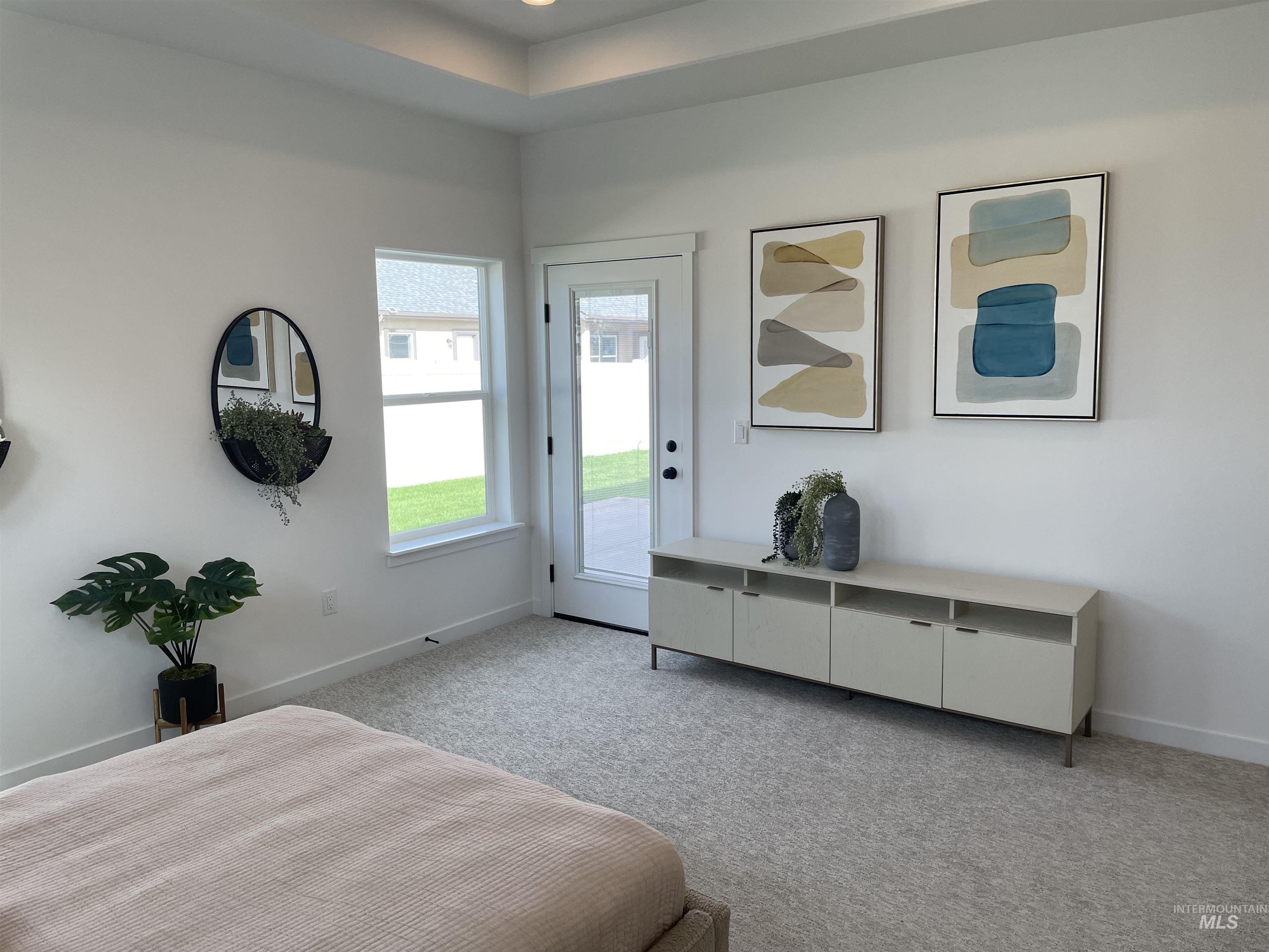 916 Kenbrook Loop Twin Falls, ID 83301 - Photo 11 of 30 Carpeted bedroom with access to exterior and baseboards