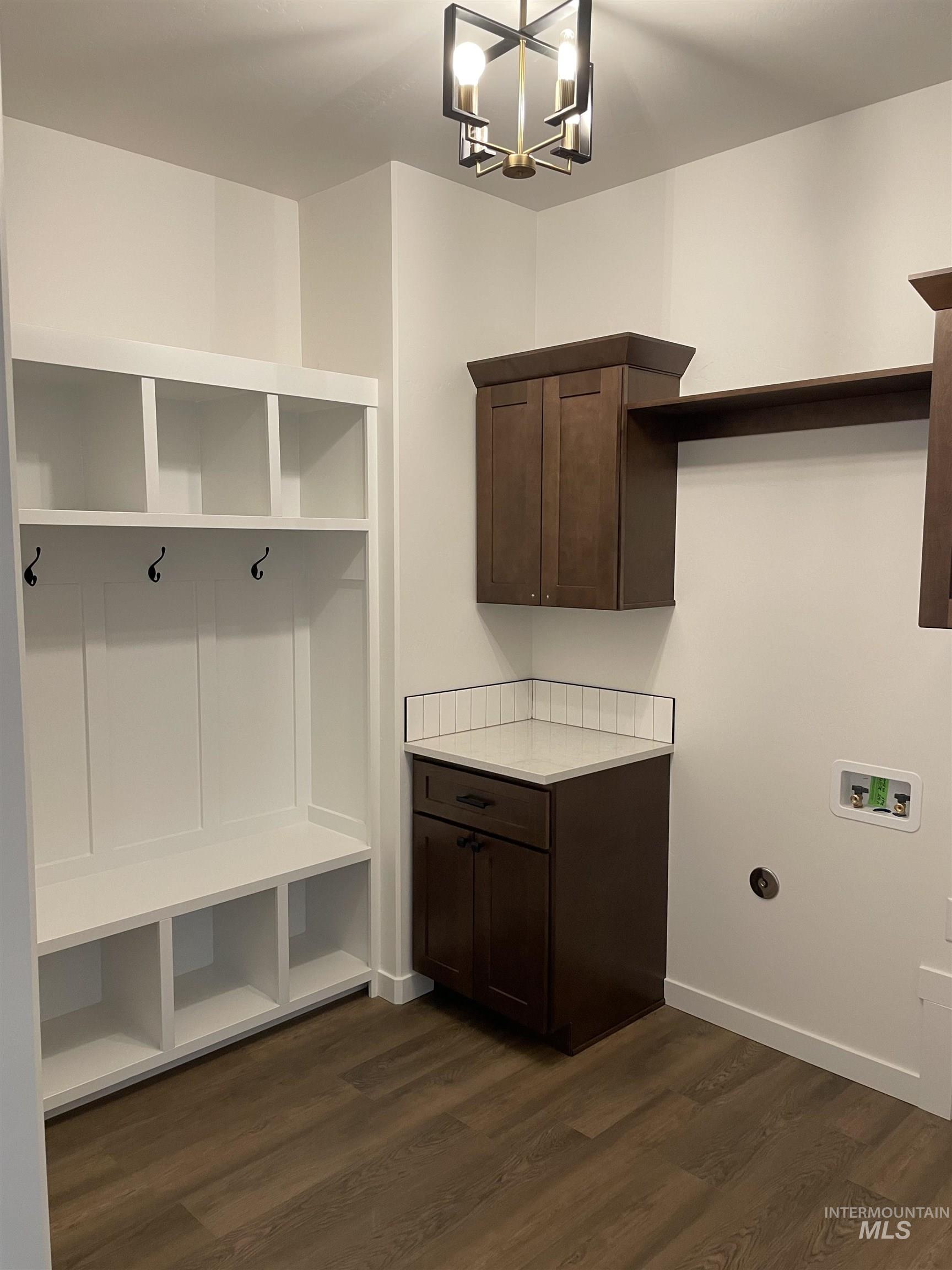 916 Kenbrook Loop Twin Falls, ID 83301 - Photo 13 of 30 Mudroom featuring dark wood-type flooring and a chandelier