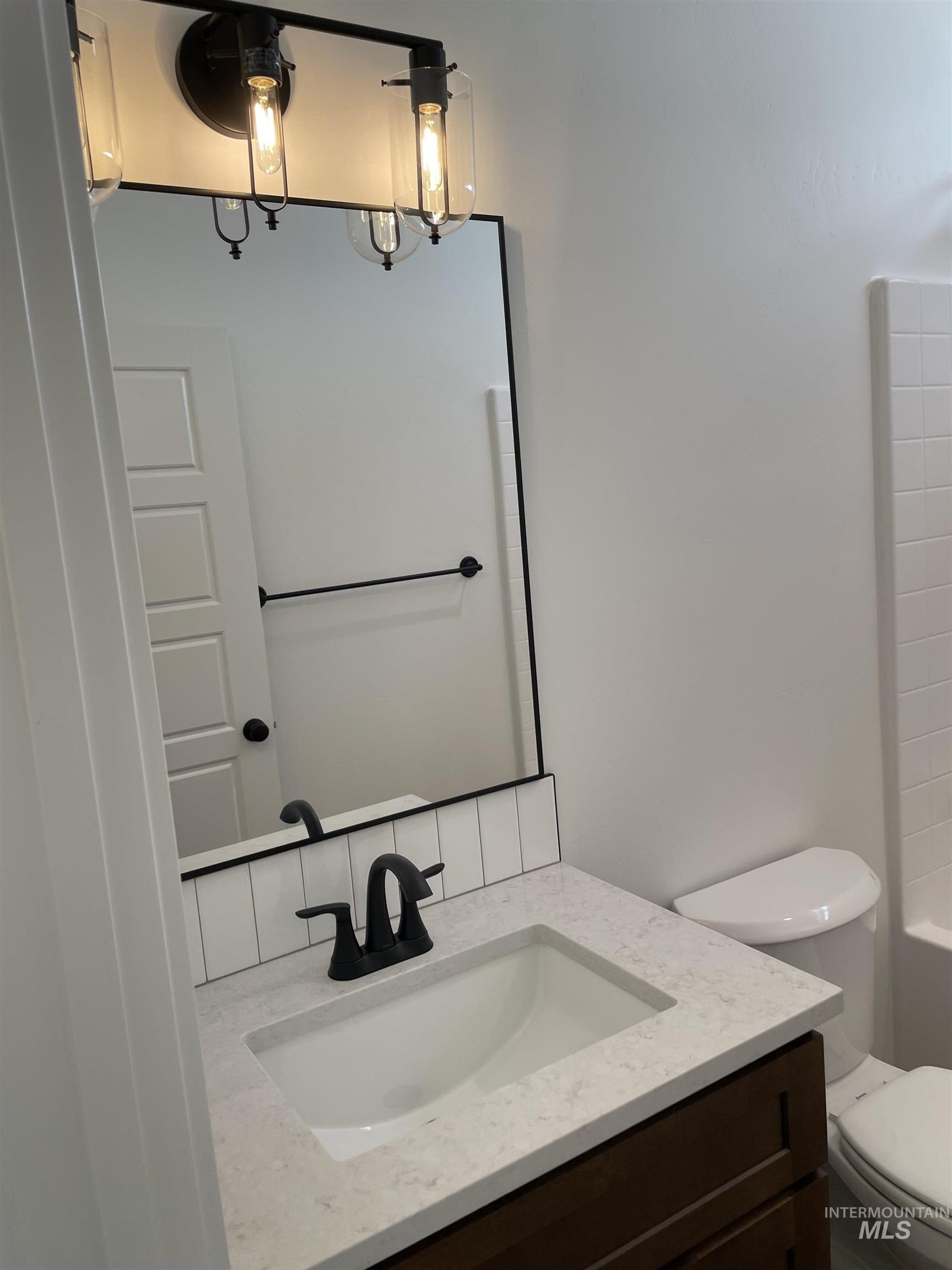 916 Kenbrook Loop Twin Falls, ID 83301 - Photo 22 of 30 Bathroom with vanity and toilet