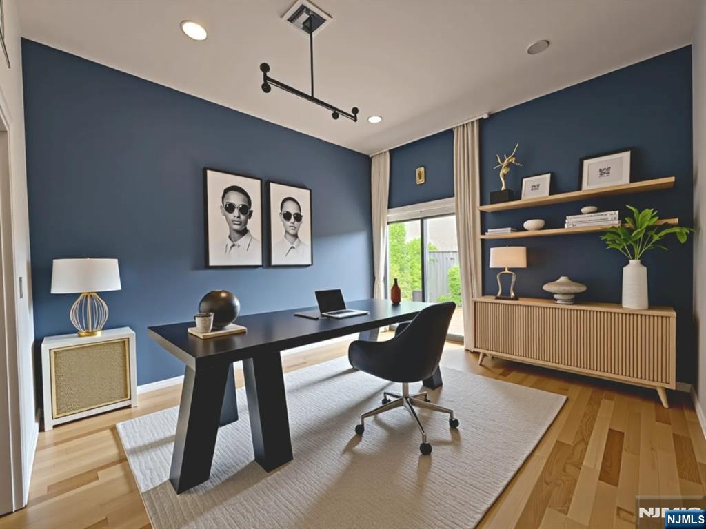 a living room with furniture a piano and a flat screen tv