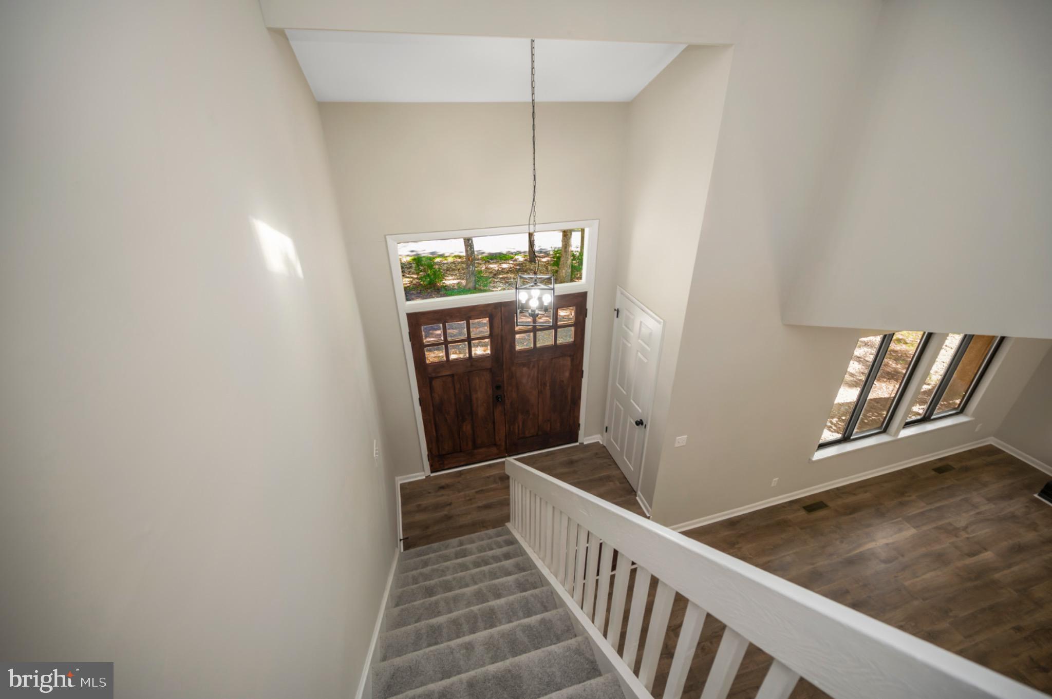 420 Birdie Road Locust Grove, VA 22508 - Photo 15 of 53 a view of a hallway with wooden floor and staircase