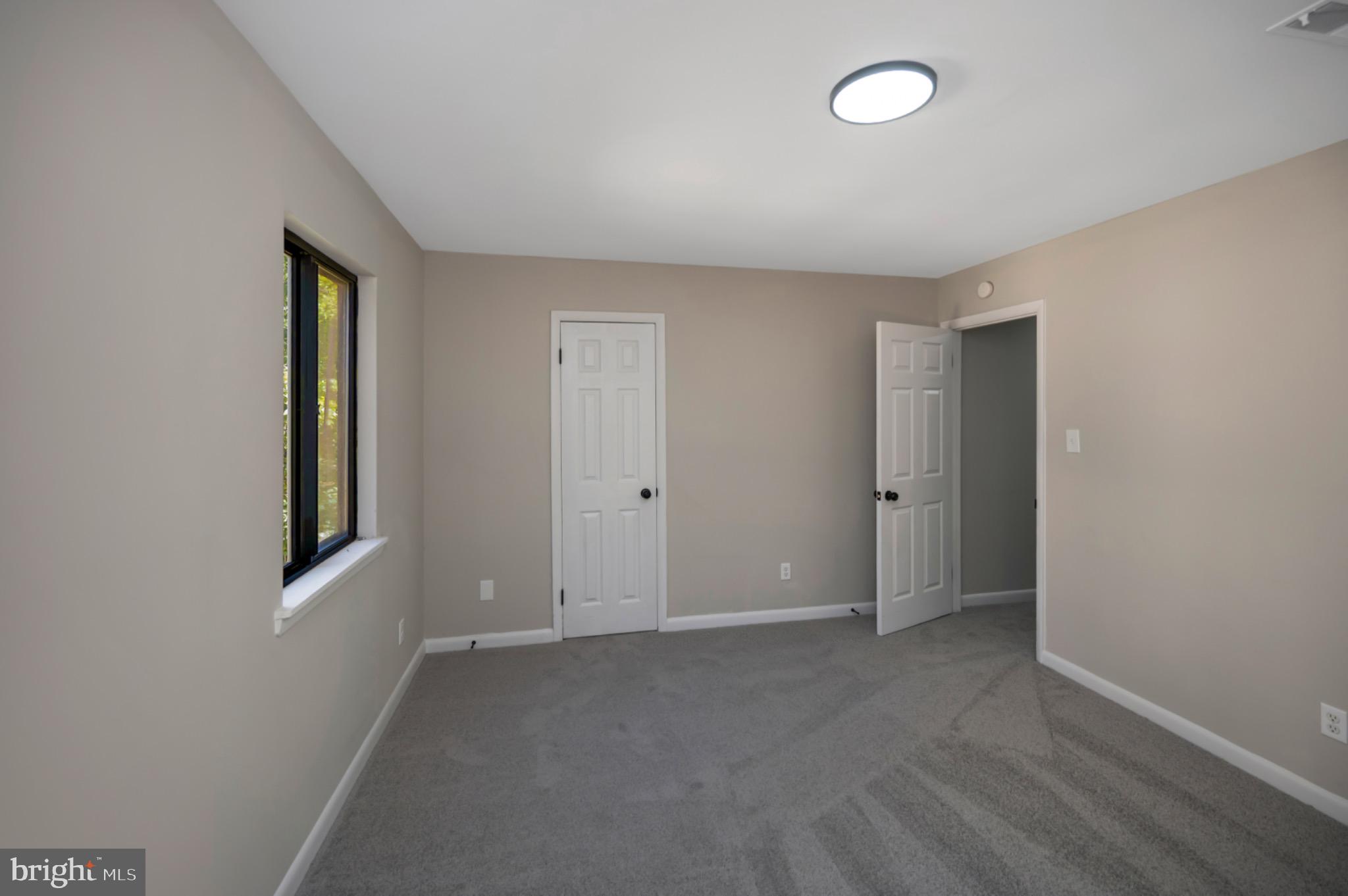 420 Birdie Road Locust Grove, VA 22508 - Photo 22 of 53 an empty room with windows and closet