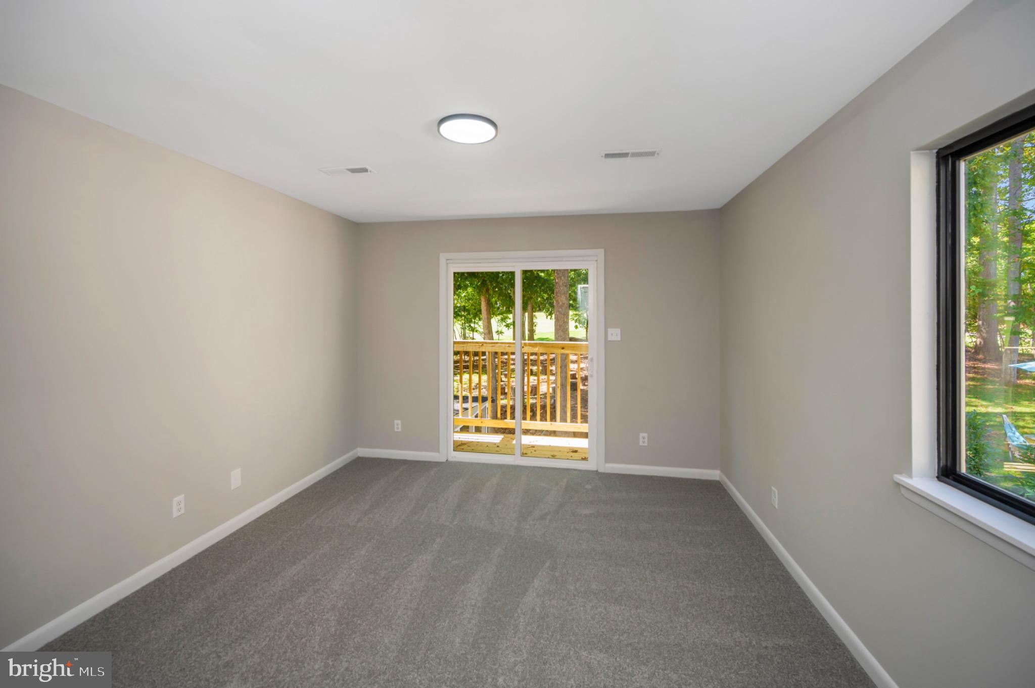420 Birdie Road Locust Grove, VA 22508 - Photo 27 of 53 an empty room with windows