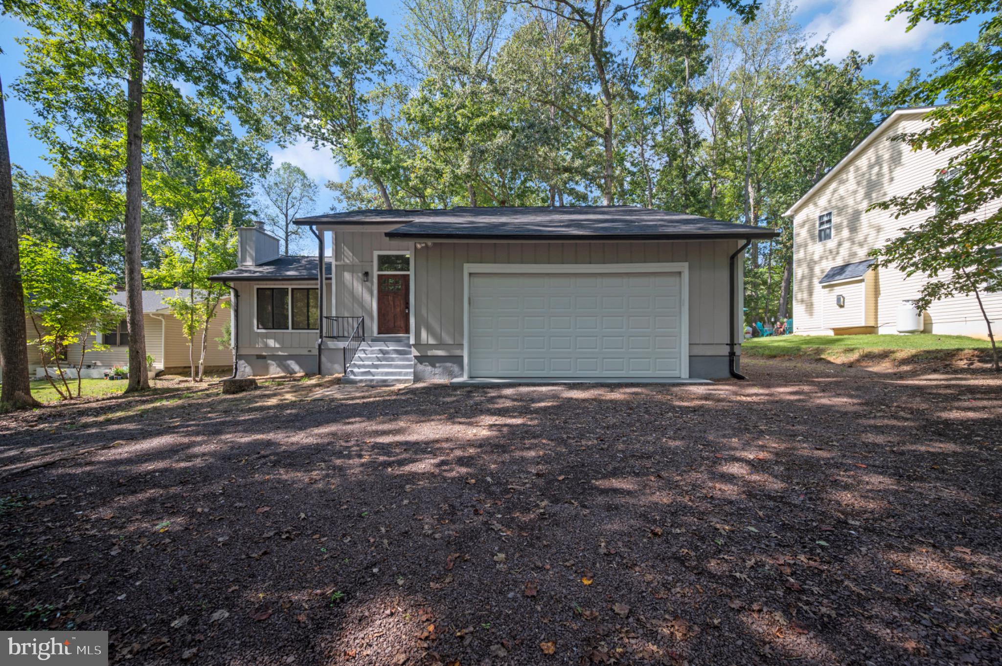 420 Birdie Road Locust Grove, VA 22508 - Photo 3 of 53 a house with trees in the background