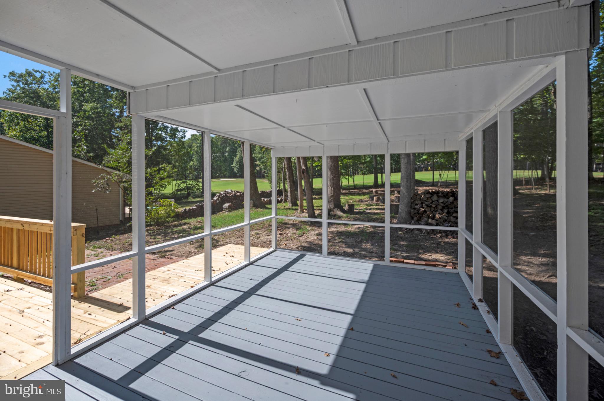 420 Birdie Road Locust Grove, VA 22508 - Photo 31 of 53 a view of a porch with wooden floor and outdoor space
