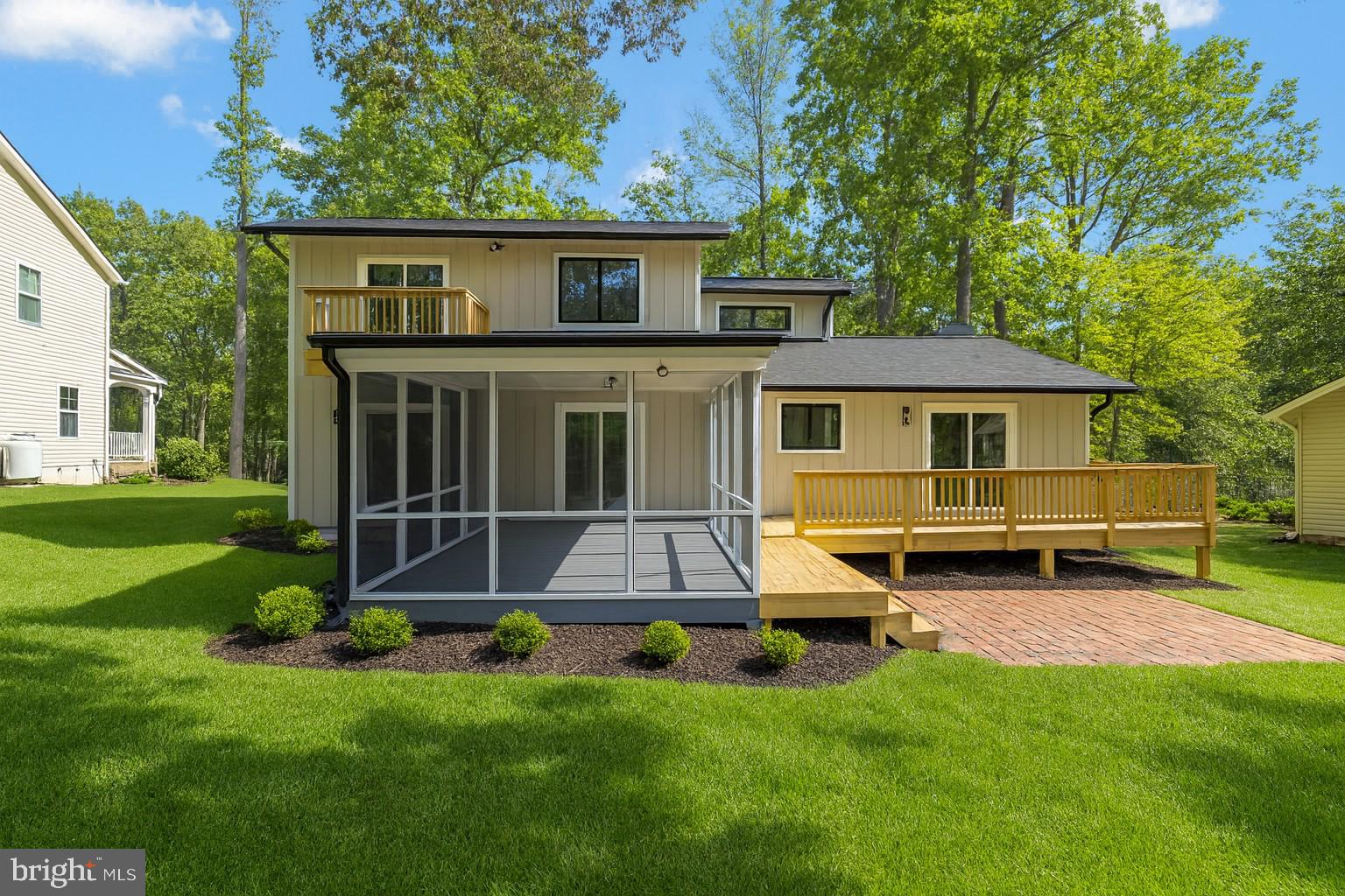 420 Birdie Road Locust Grove, VA 22508 - Photo 34 of 53 a view of backyard of house with deck and outdoor seating