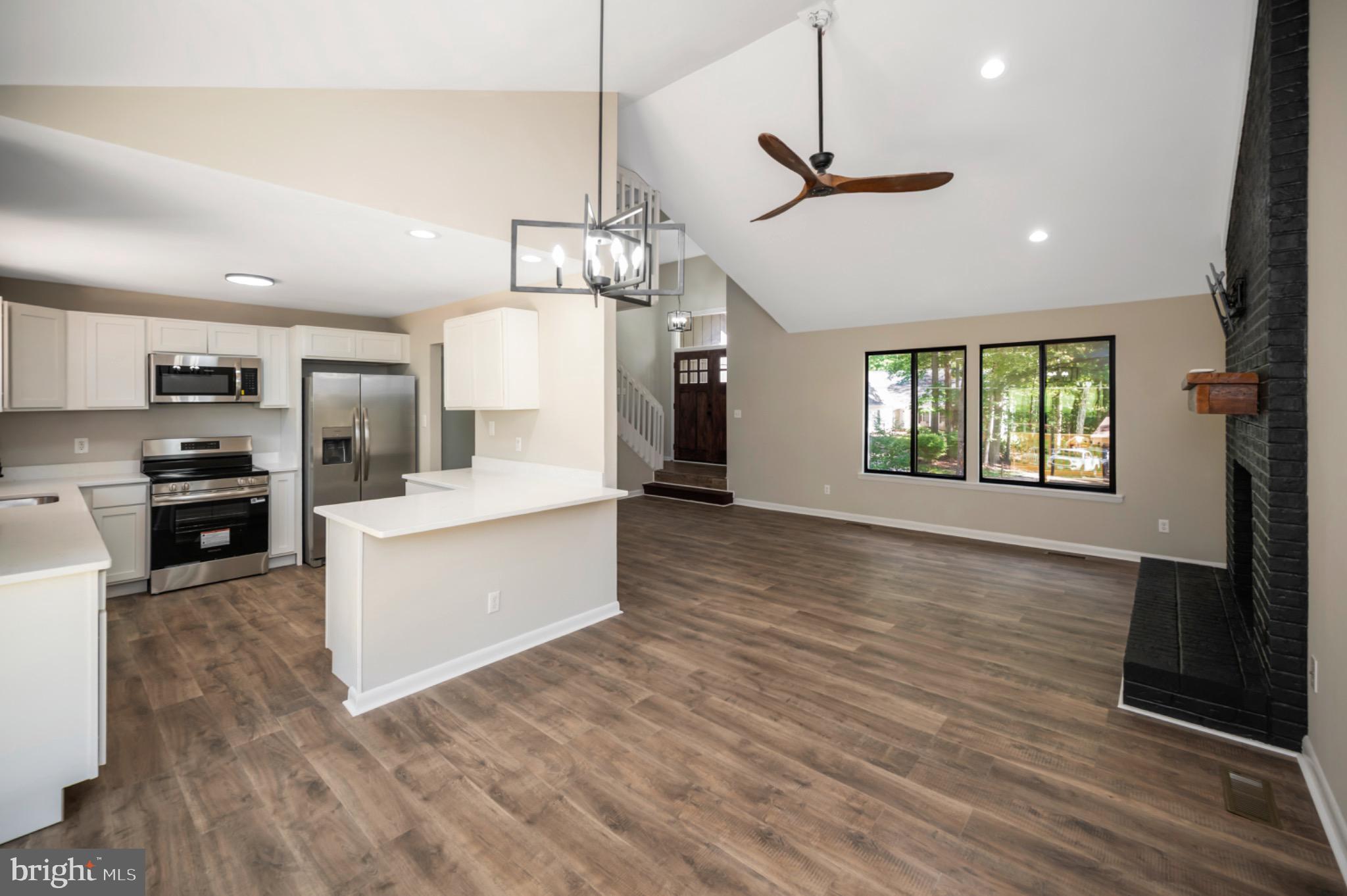 420 Birdie Road Locust Grove, VA 22508 - Photo 8 of 53 a large kitchen with granite countertop a large counter top appliances and cabinets