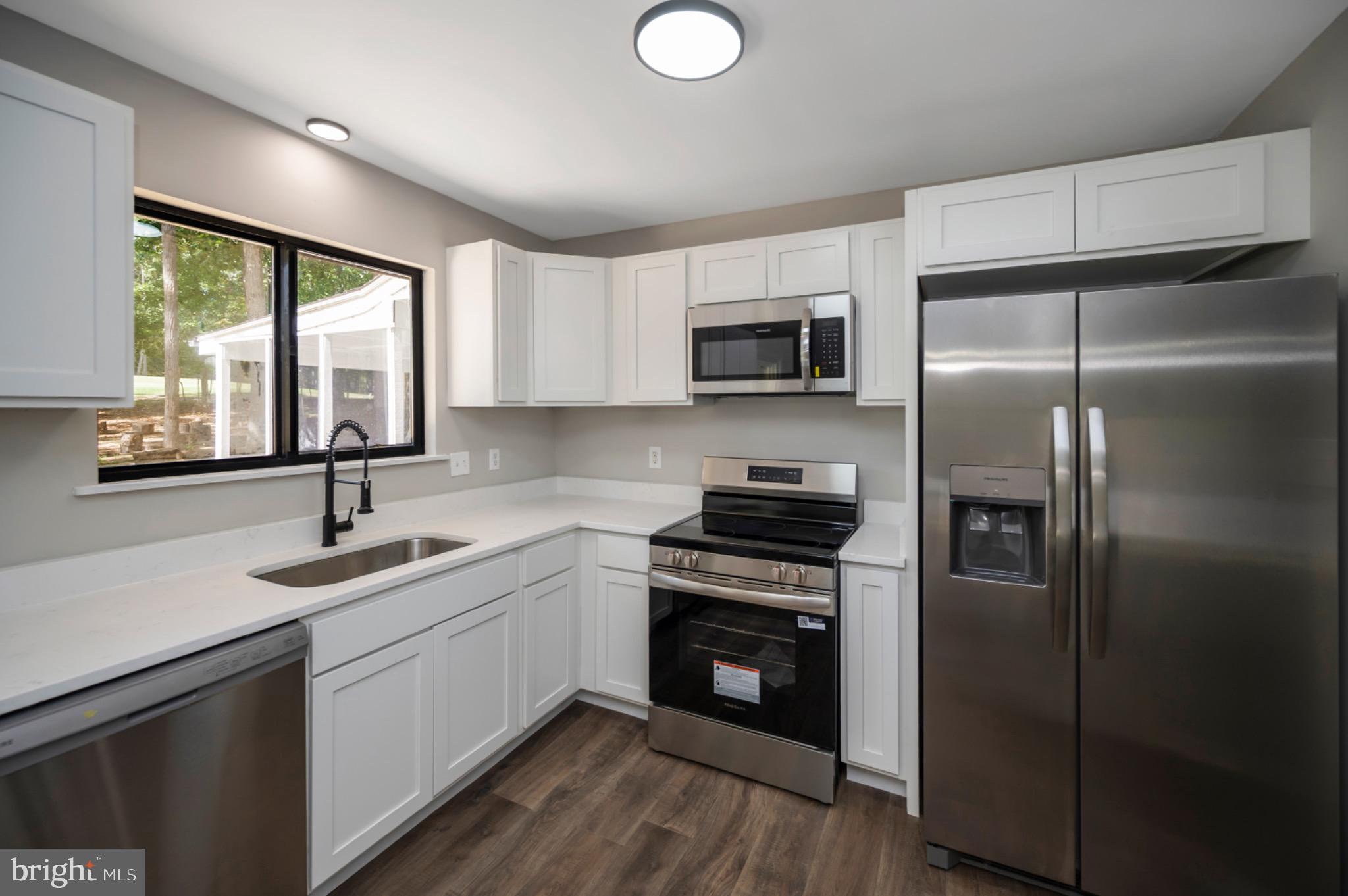 420 Birdie Road Locust Grove, VA 22508 - Photo 9 of 53 a kitchen with stainless steel appliances a refrigerator sink and microwave