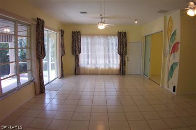 9010 West Ridge Court Fort Myers, FL 33912 - Photo 4 of 10 a view of entryway with a door and chandelier fan
