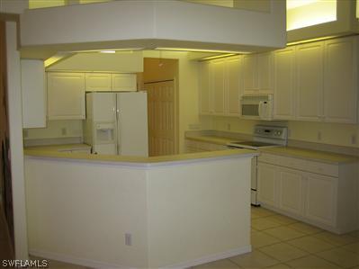 9010 West Ridge Court Fort Myers, FL 33912 - Photo 5 of 10 a bathroom with a shower and a sink