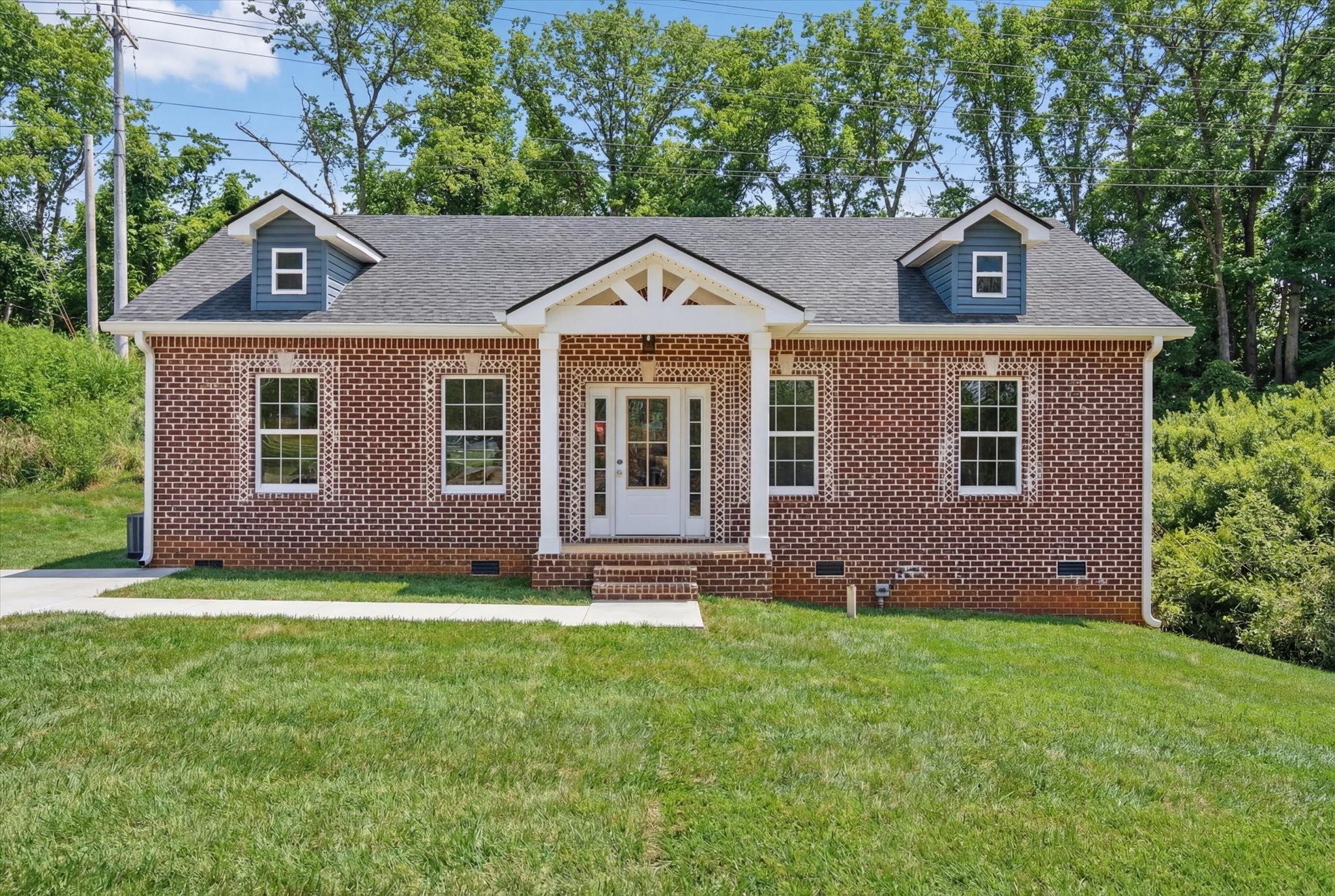 613 Hill Road Clarksville, TN 37040 - Photo 1 of 37 a front view of a house with a yard and garage