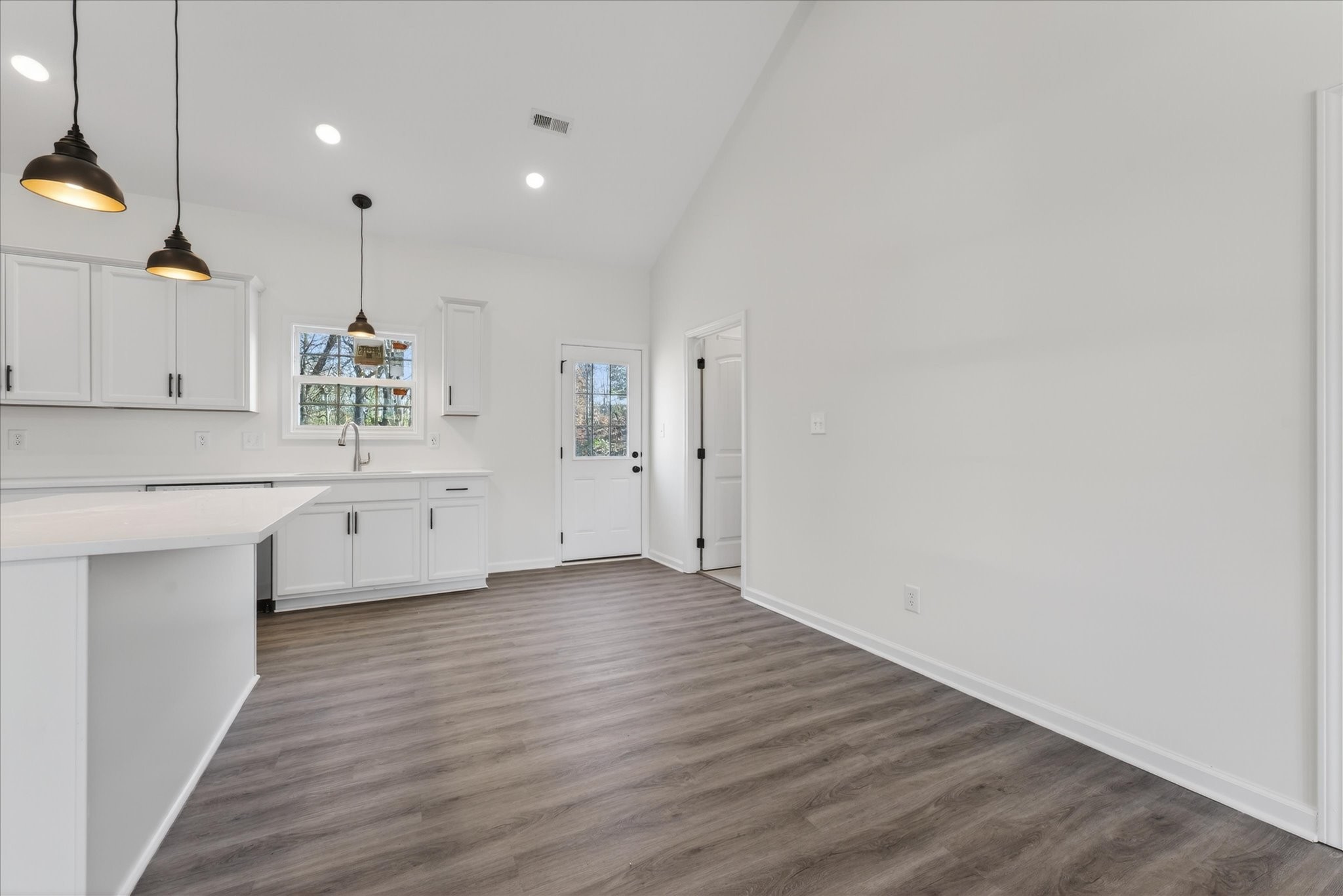 613 Hill Road Clarksville, TN 37040 - Photo 17 of 37 a view of a kitchen with wooden floor and electronic appliances