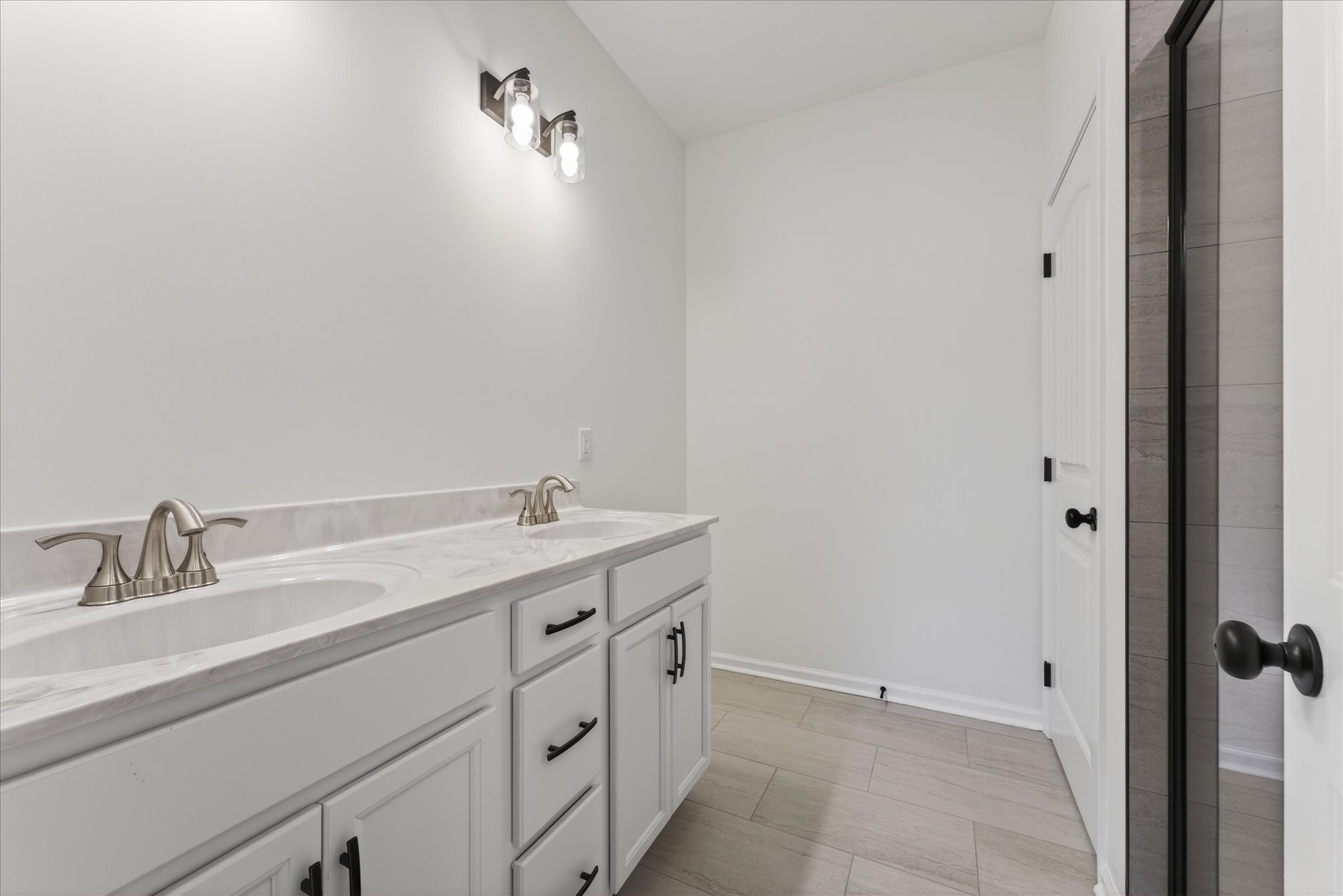 613 Hill Road Clarksville, TN 37040 - Photo 23 of 37 a bathroom with a double vanity sink and mirror