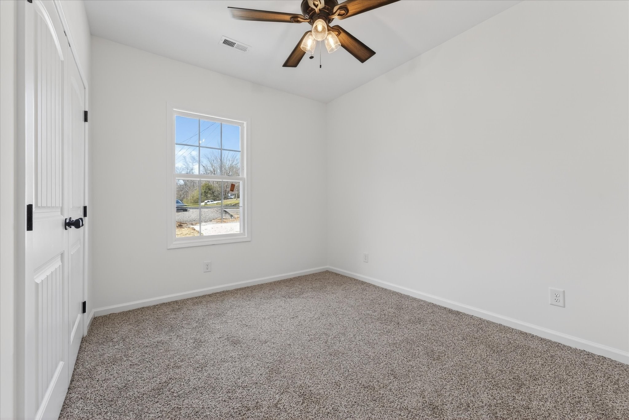 613 Hill Road Clarksville, TN 37040 - Photo 26 of 37 an empty room with windows and fan