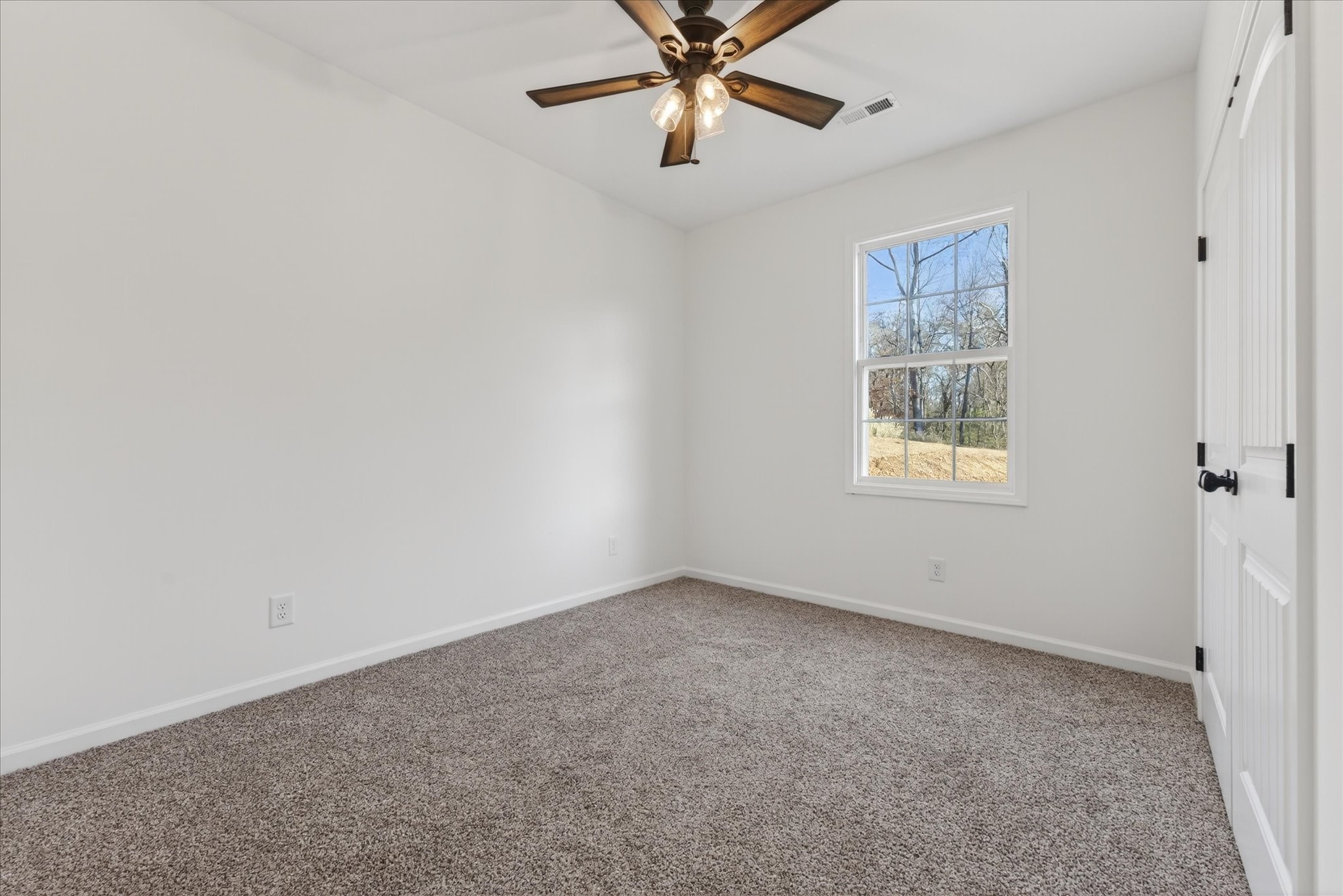 613 Hill Road Clarksville, TN 37040 - Photo 28 of 37 an empty room with a window and a fan