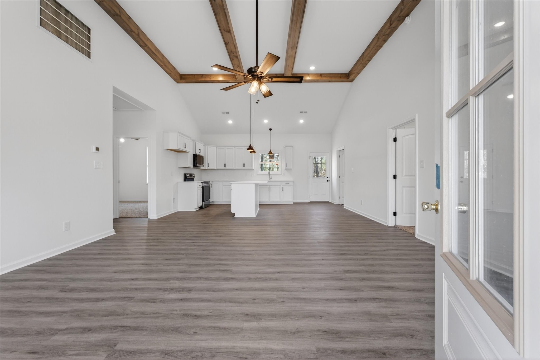 613 Hill Road Clarksville, TN 37040 - Photo 7 of 37 a view of empty room with wooden floor and ceiling fan