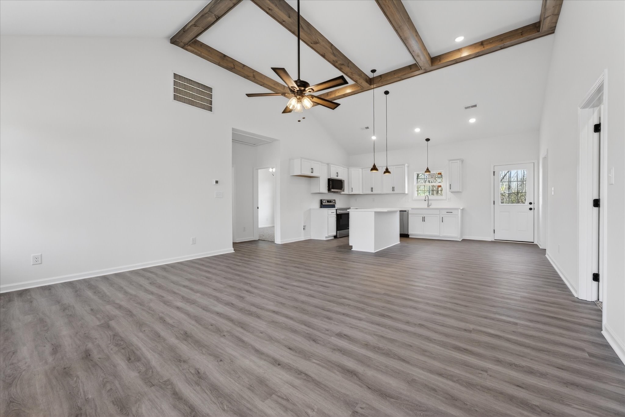 613 Hill Road Clarksville, TN 37040 - Photo 8 of 37 a view of a kitchen with a dishwasher and wooden floor