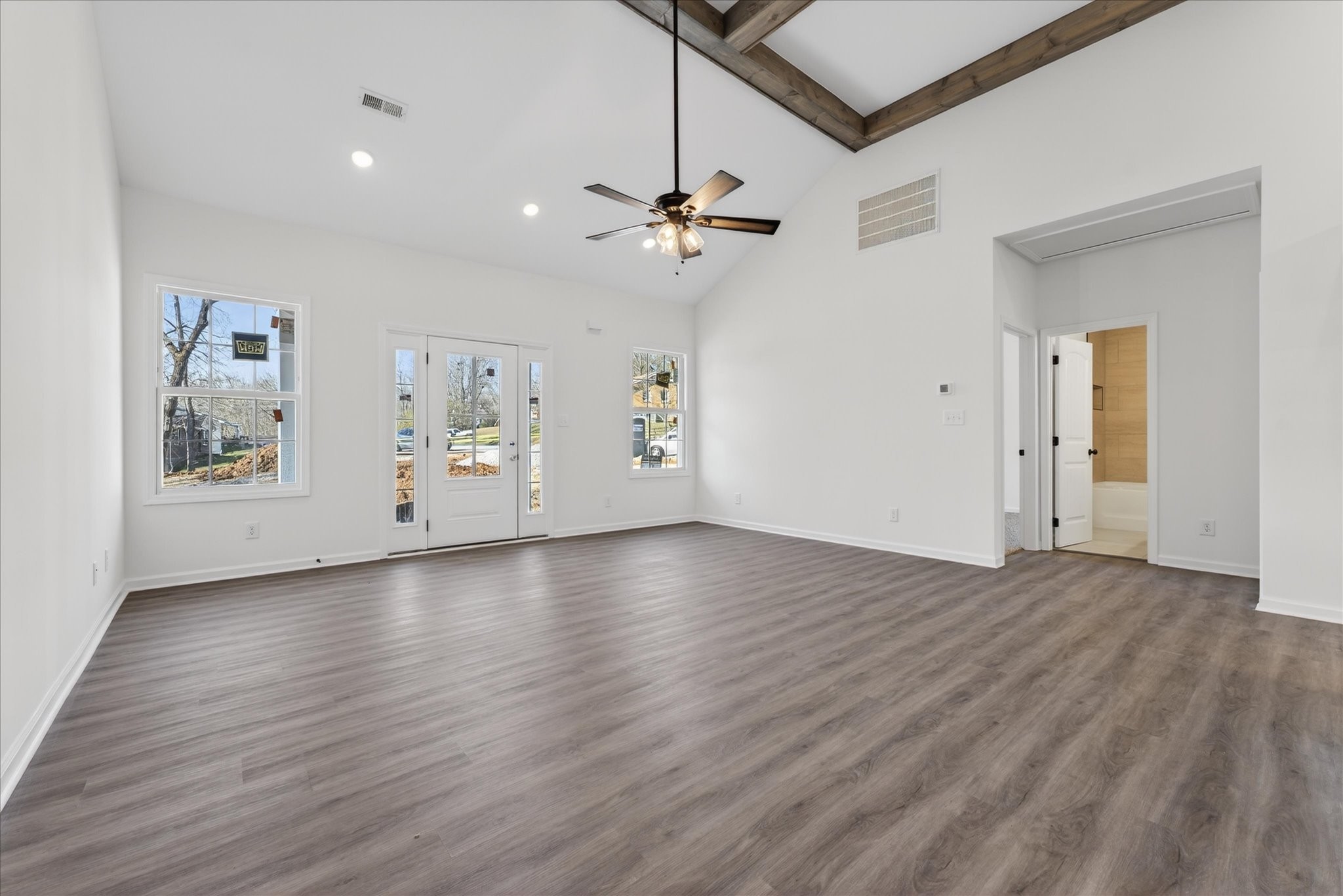 613 Hill Road Clarksville, TN 37040 - Photo 9 of 37 a view of an empty room with window and wooden floor