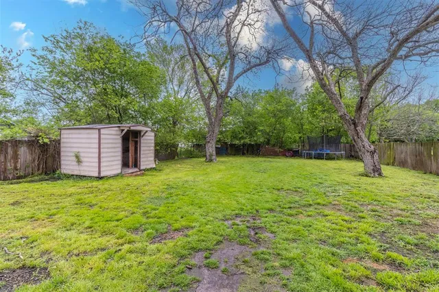 a backyard of a house with lots of green space