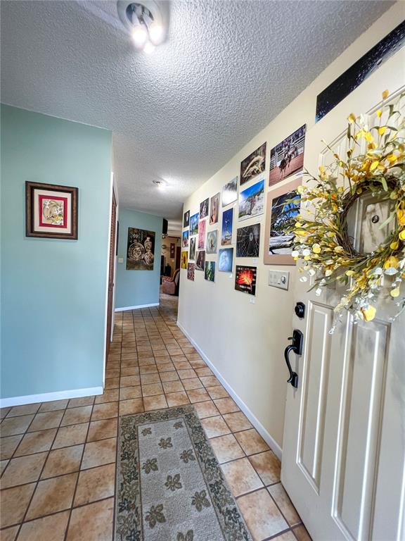 12156 98th Avenue North Seminole, FL 33772 - Photo 35 of 68 a view of a hallway with wooden floor and windows
