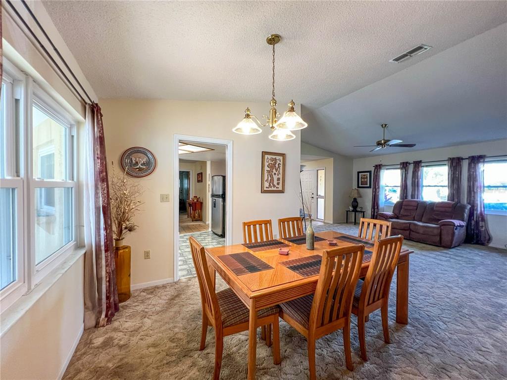 12156 98th Avenue North Seminole, FL 33772 - Photo 45 of 68 a view of a dining room with furniture