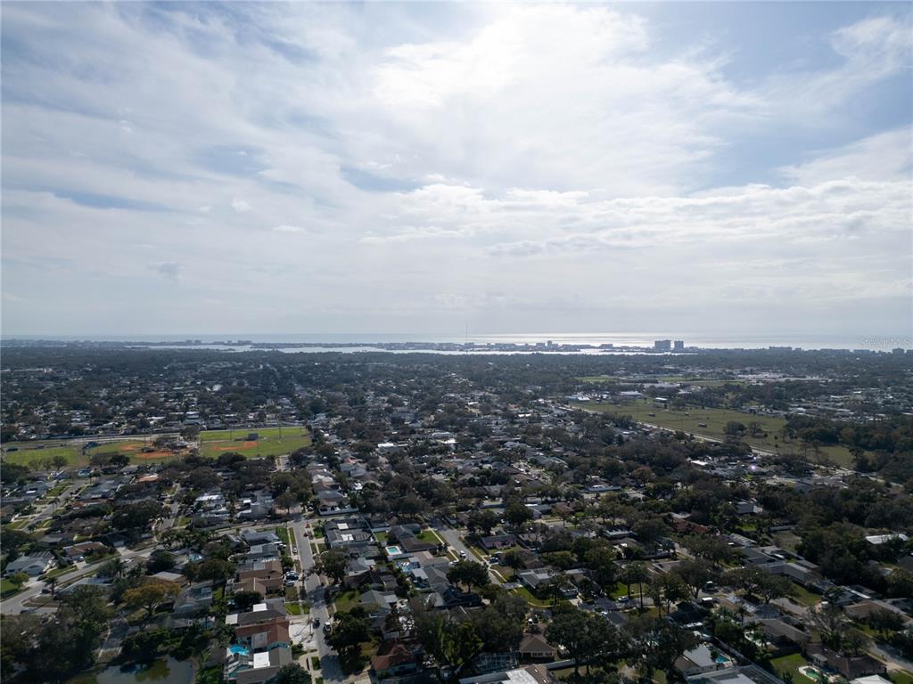 12156 98th Avenue North Seminole, FL 33772 - Photo 60 of 68 an aerial view of residential building and trees around