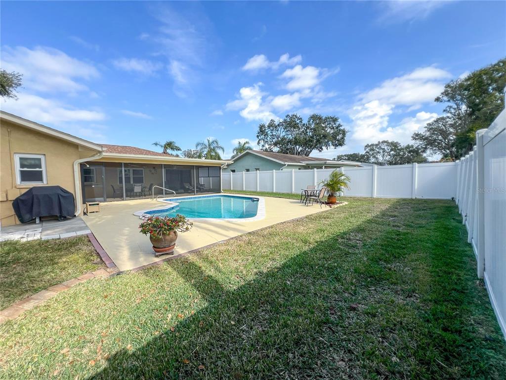 12156 98th Avenue North Seminole, FL 33772 - Photo 65 of 68 a view of a house with a yard