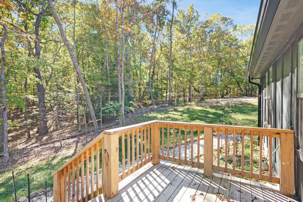 2266 Timberwood Trace Monteagle, TN 37356 - Photo 22 of 47 a view of a wooden deck next to a yard