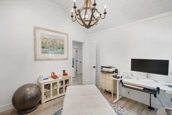 a bedroom with furniture and a window