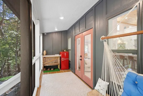 a bedroom with furniture and a window