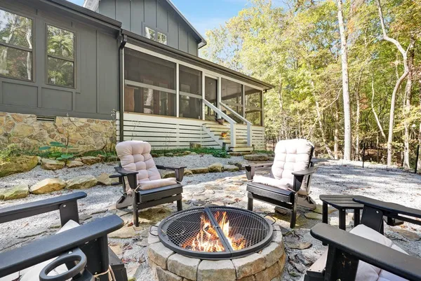 a view of a chairs and table in patio