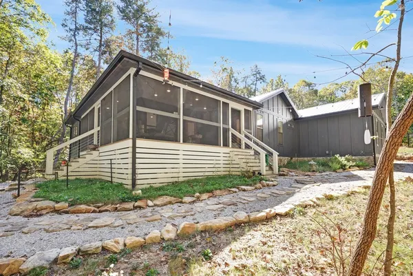 a house with trees in the background