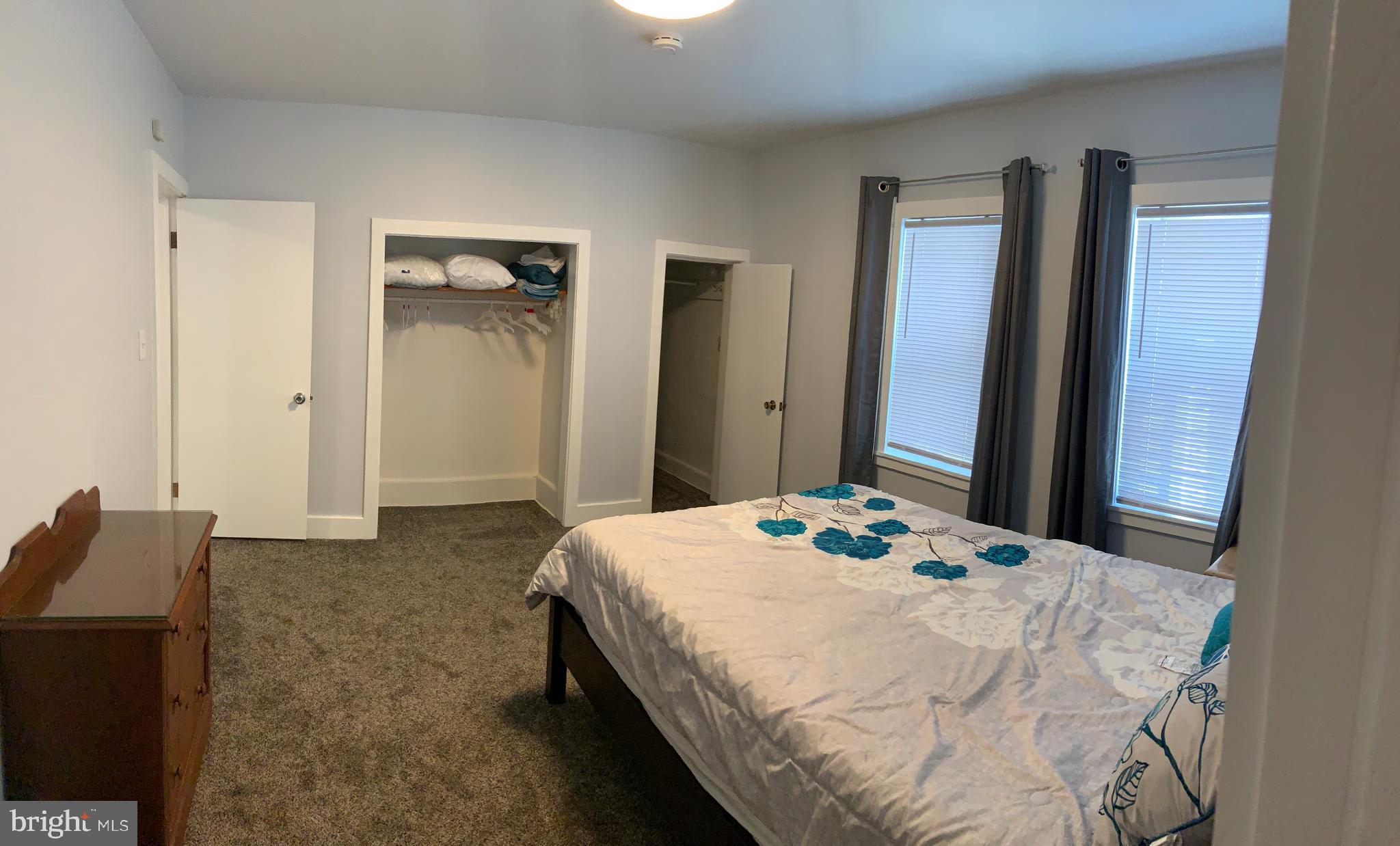 89 Second Street Keyser, WV 26726 - Photo 31 of 37 a bedroom with a bed and a large mirror