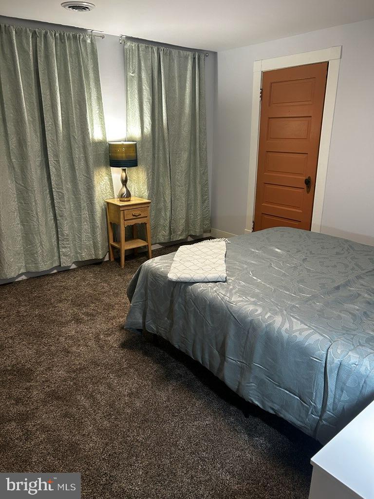 89 Second Street Keyser, WV 26726 - Photo 10 of 37 a spacious bedroom with a bed and a cabinets