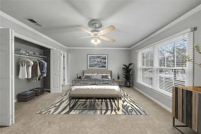 a view of an empty room with a ceiling fan