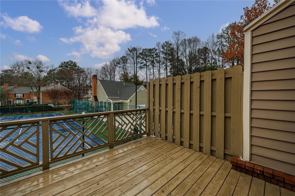 125 Mt Vernon Circle Atlanta, GA 30338 - Photo 35 of 62 a view of balcony with wooden floor and fence