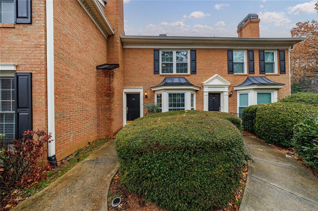 125 Mt Vernon Circle Atlanta, GA 30338 - Photo 41 of 62 a front view of a house with a garden