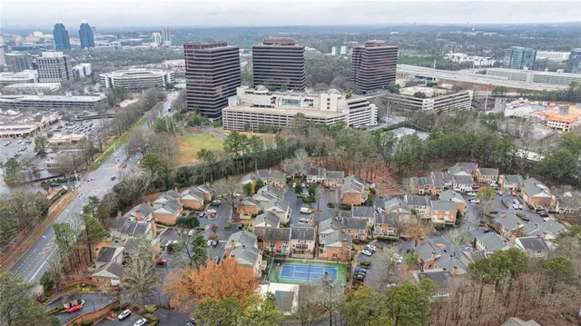 an aerial view of residential houses with outdoor space