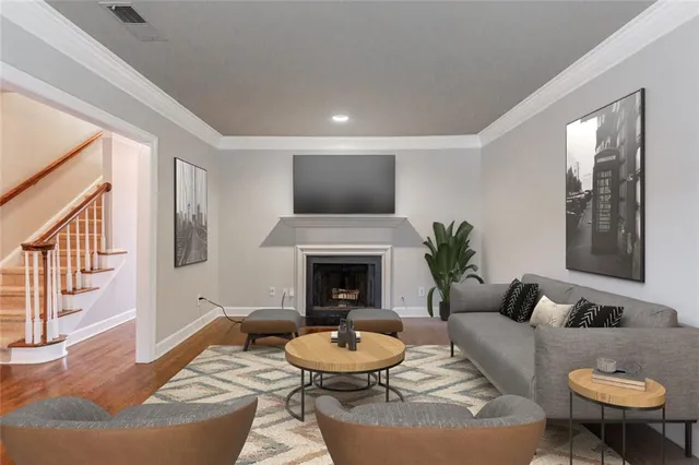 wooden floor fireplace and windows in an empty room