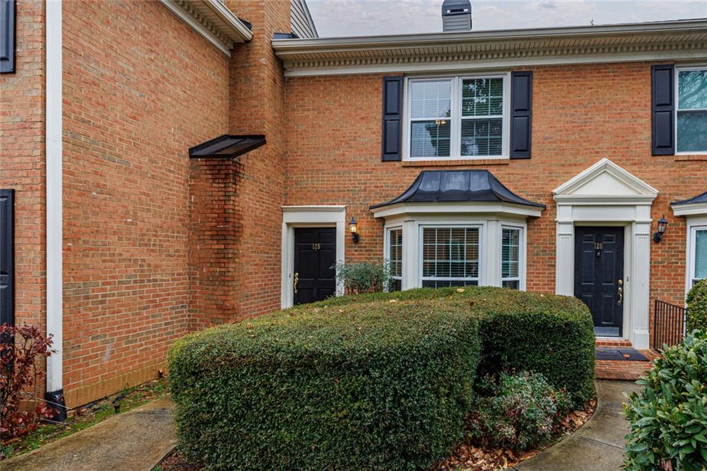 125 Mt Vernon Circle Atlanta, GA 30338 - Photo 55 of 62 a front view of a house with a yard