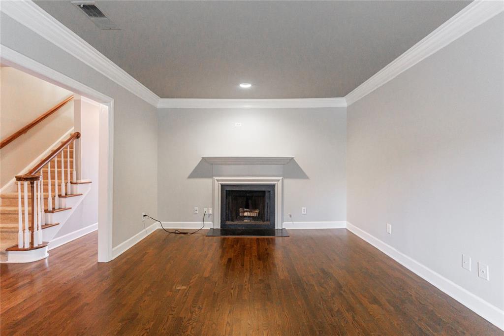 125 Mt Vernon Circle Atlanta, GA 30338 - Photo 6 of 62 wooden floor fireplace and windows in an empty room